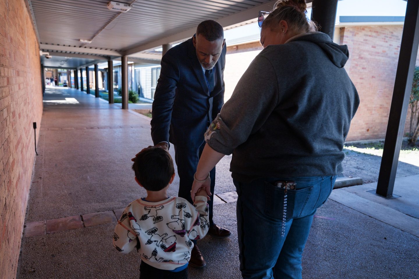 Lackland Independent School District Superintendent Dr. Burnie Roper checks on a student while walking around the campus Monday, Nov. 3, 2025, in San Antonio.