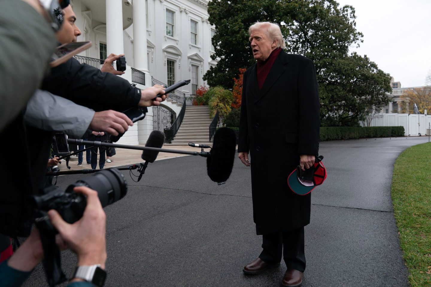 President Donald Trump talks to reporters as he departs from the White House on Saturday, en route to Joint Base Andrews.