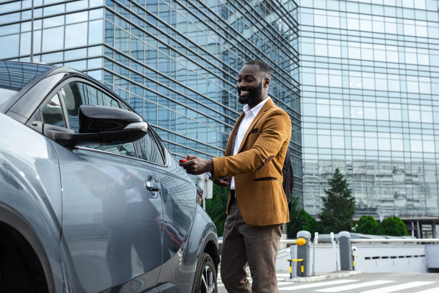 Man walking to car in city
