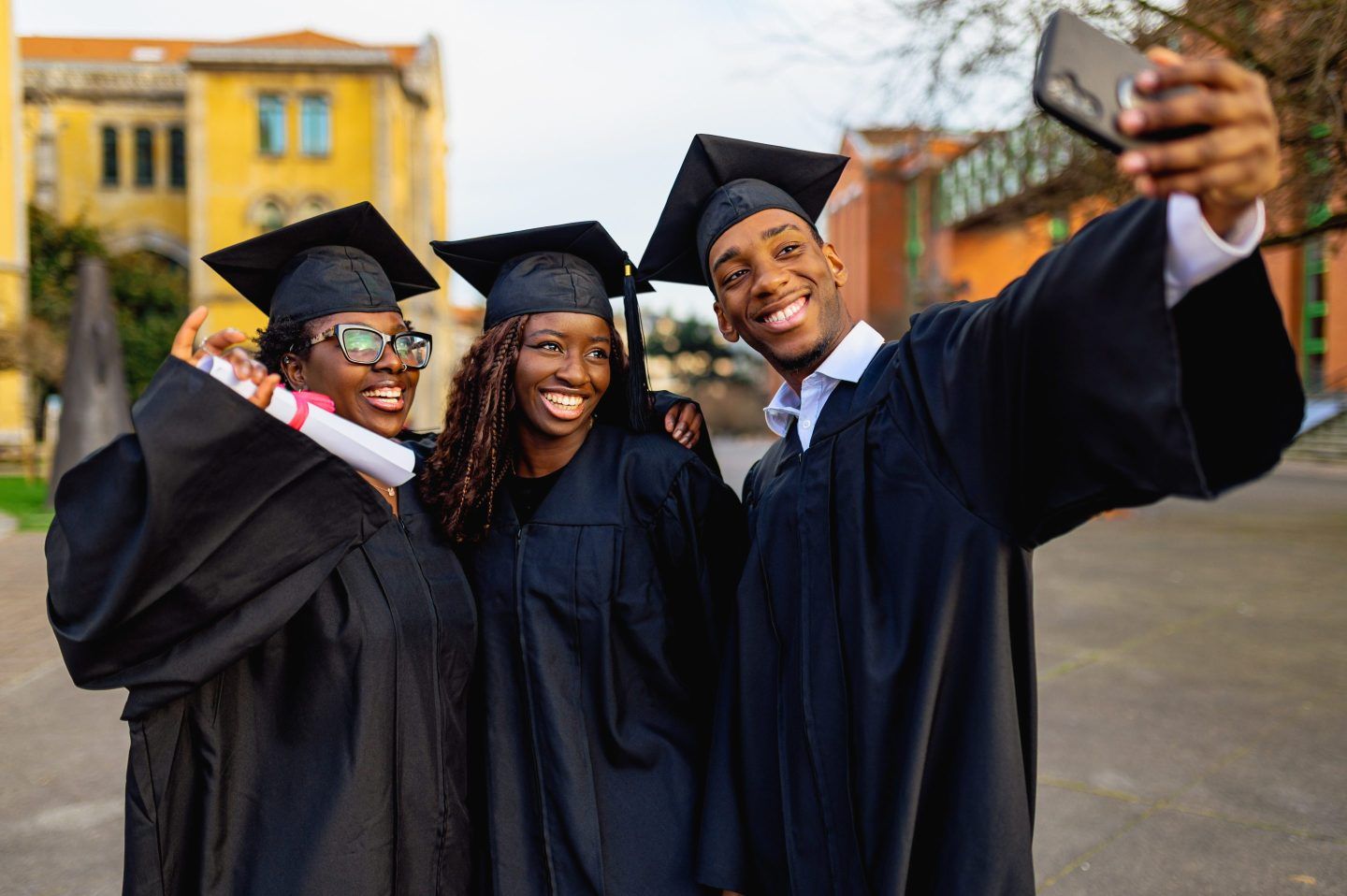 Three graduates take selfie