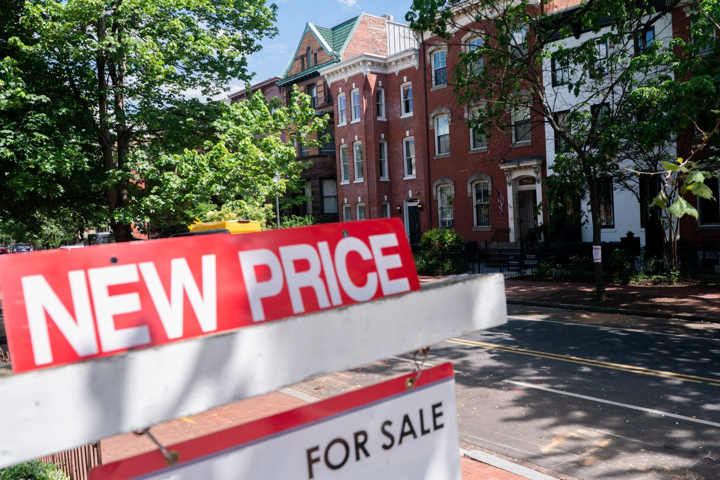 A "New Price For Sale" sign in front of a home in Washington, DC, US, on Thursday, May 8, 2025.