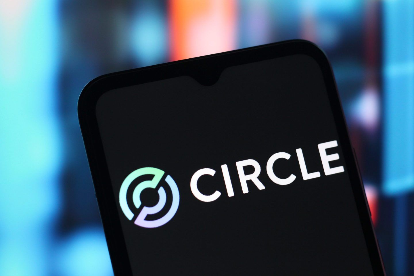 The Circle Internet Group logo is seen displayed on a smartphone screen.