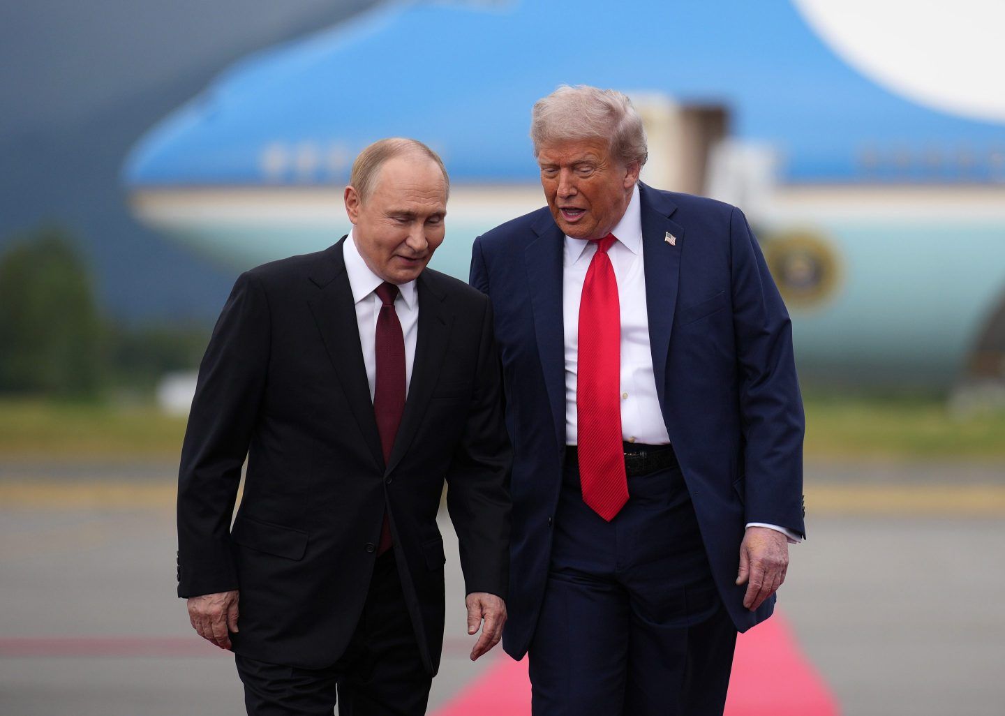 President Donald Trump greets Russian President Vladimir Putin as he arrives at Joint Base Elmendorf-Richardson in August 2025 in Anchorage, Alaska.