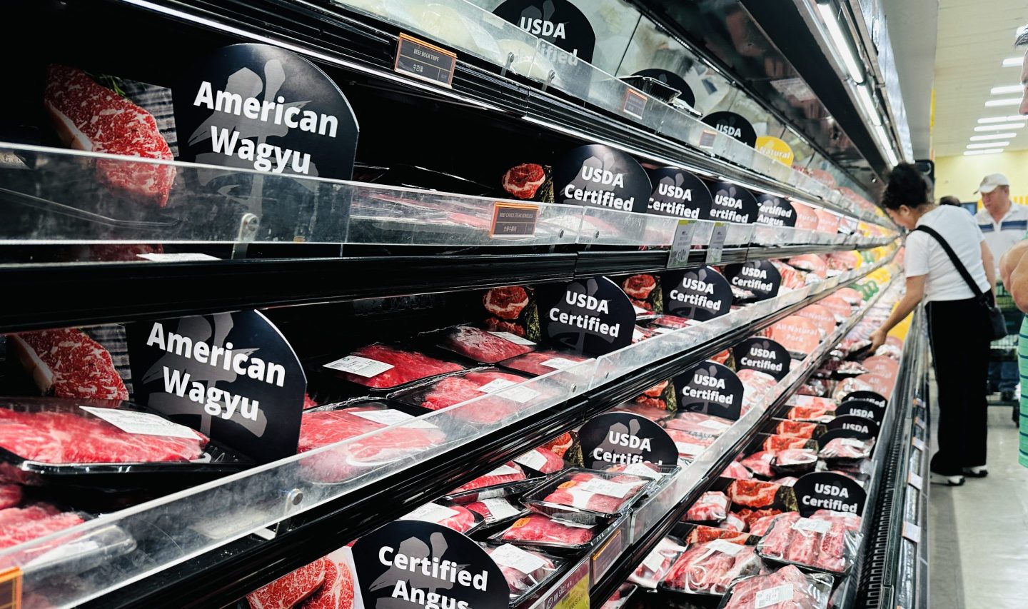 People shop the meat section at a supermarket in Alhambra, California, on September 10, 2025. 