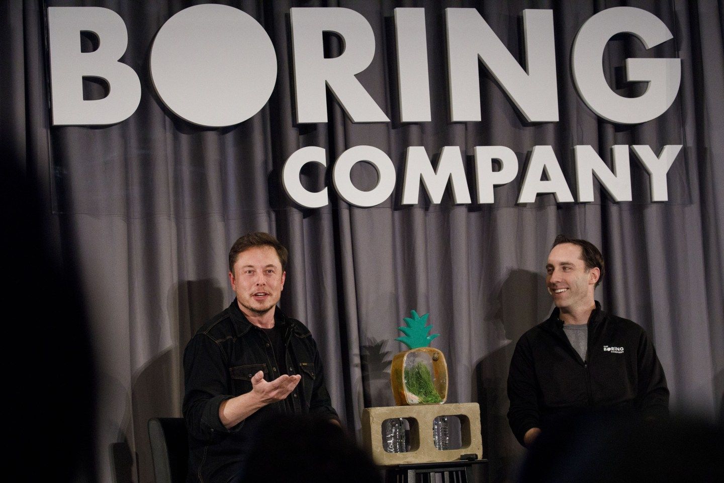 Elon Musk (left) and Steve Davis, president of Boring Company at a Boring event in 2018 in Los Angeles