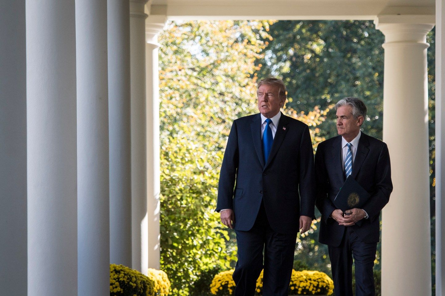 President Donald Trump walks out with Federal Reserve board member Jerome Powell