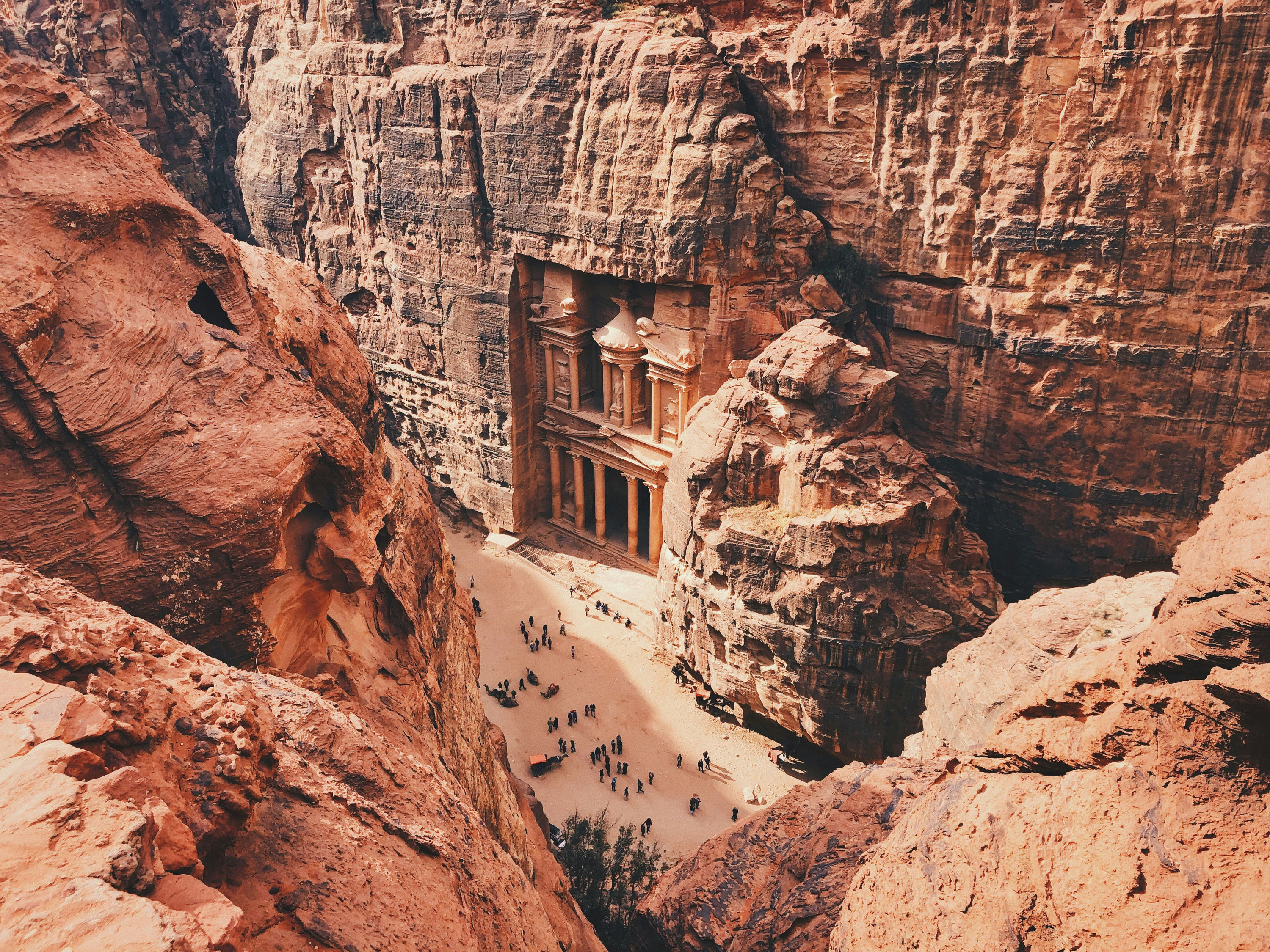 A high view through the Siq toward the Treasury carved into the cliff at Petra.