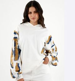 Ofertas de Buzo TENNIS tipo hoodie crudo para mujer