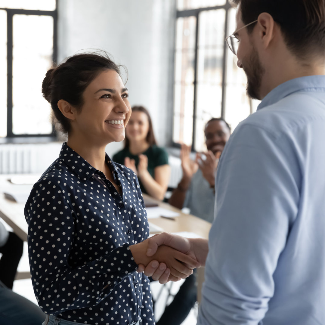 a man and woman shaking hands