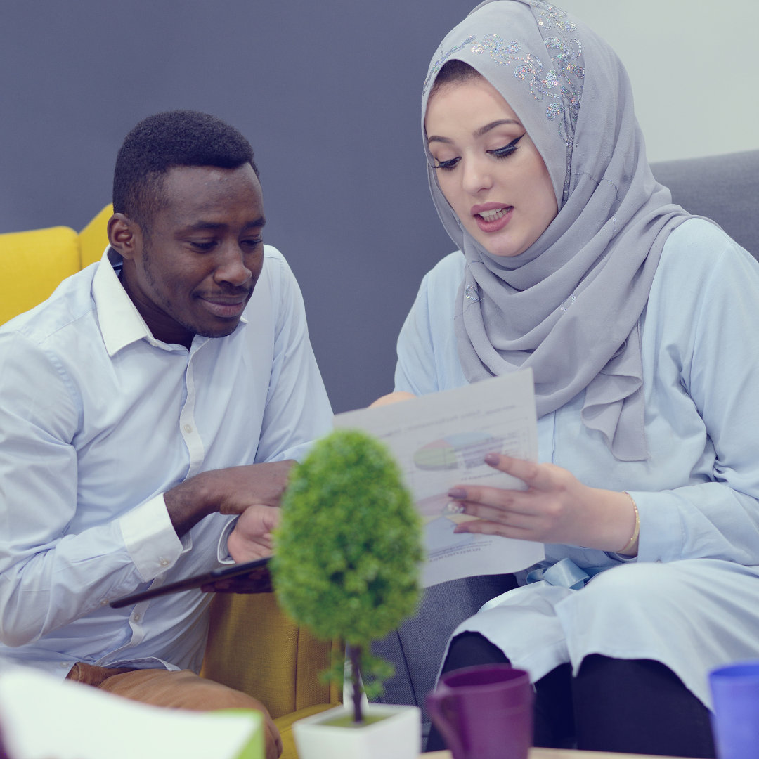 a woman discussing something with a man