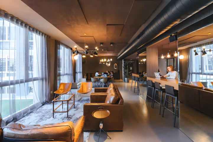 What is the Economic Impact of Coworking Spaces and Hybrid Work Models on Businesses?