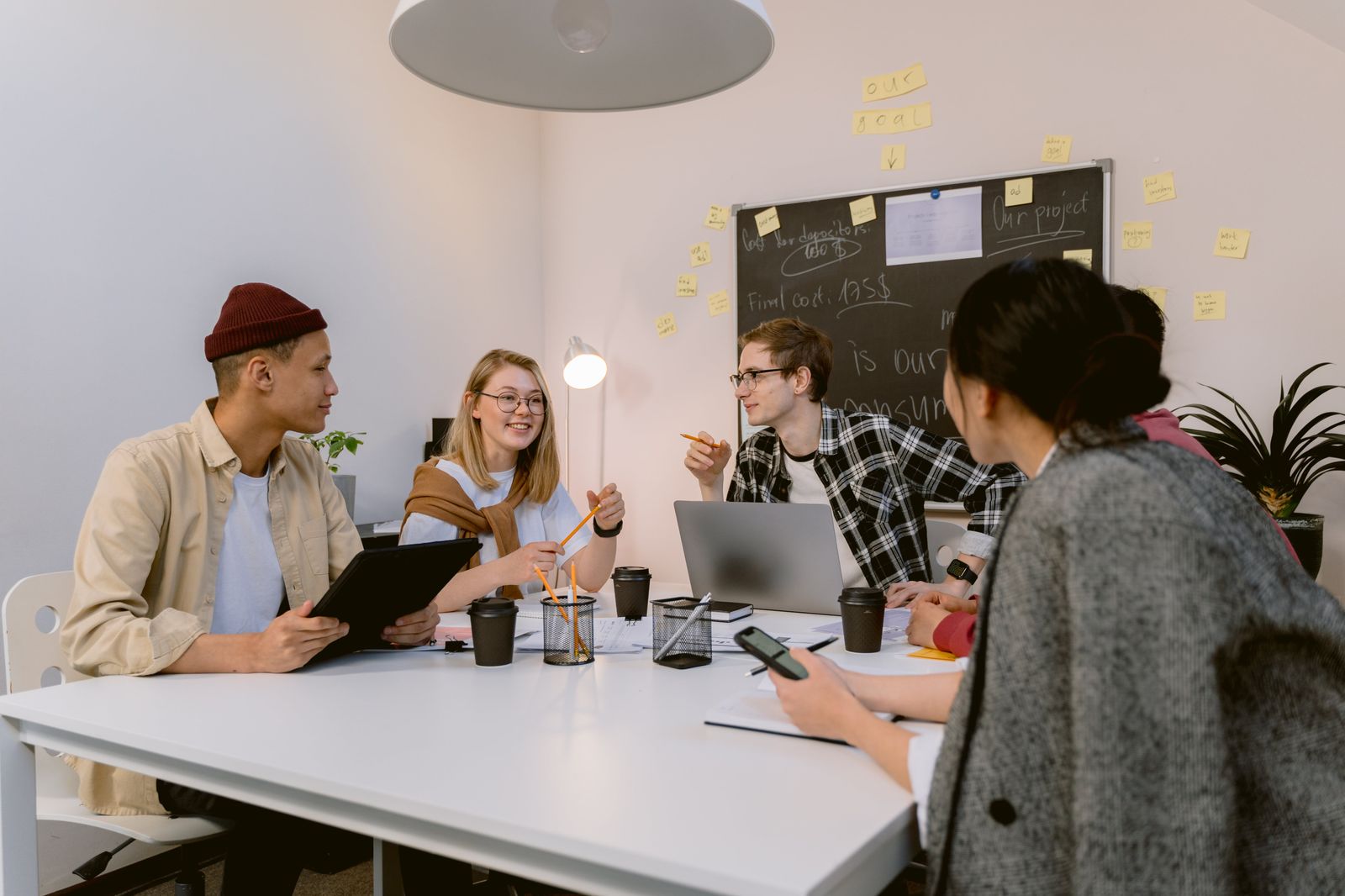 A group of people discussing in coworking space