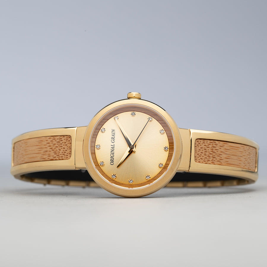 Gold & Bamboo Wood Women's Bangle 32mm lay down on side.