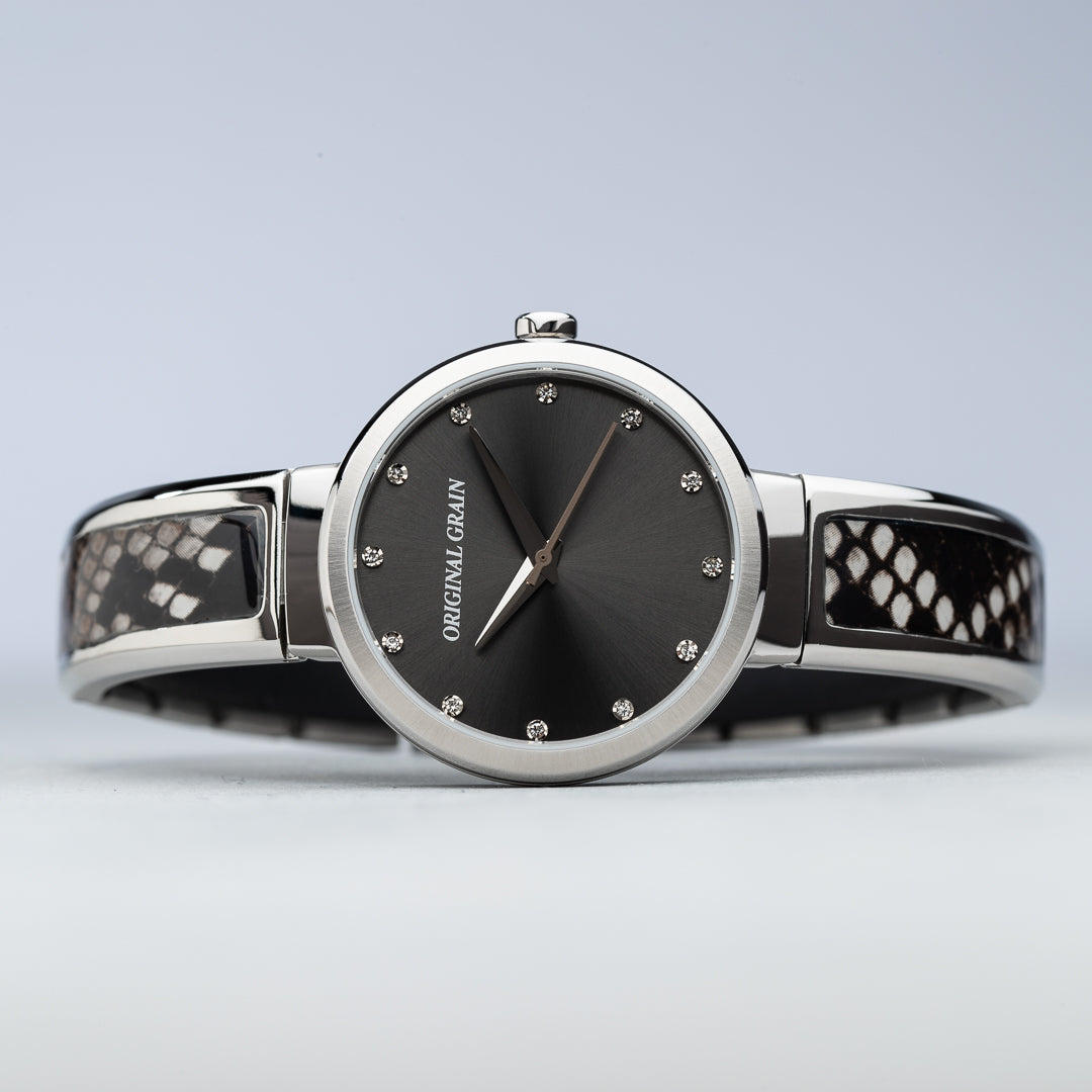 Legen Sie das Bild des Damenarmbands mit Stahl- und Schlangenmuster, 32 mm, hin