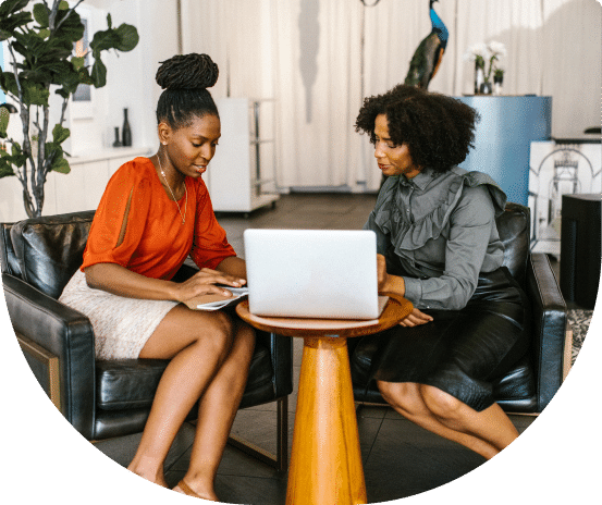 photo of two ladies discussing