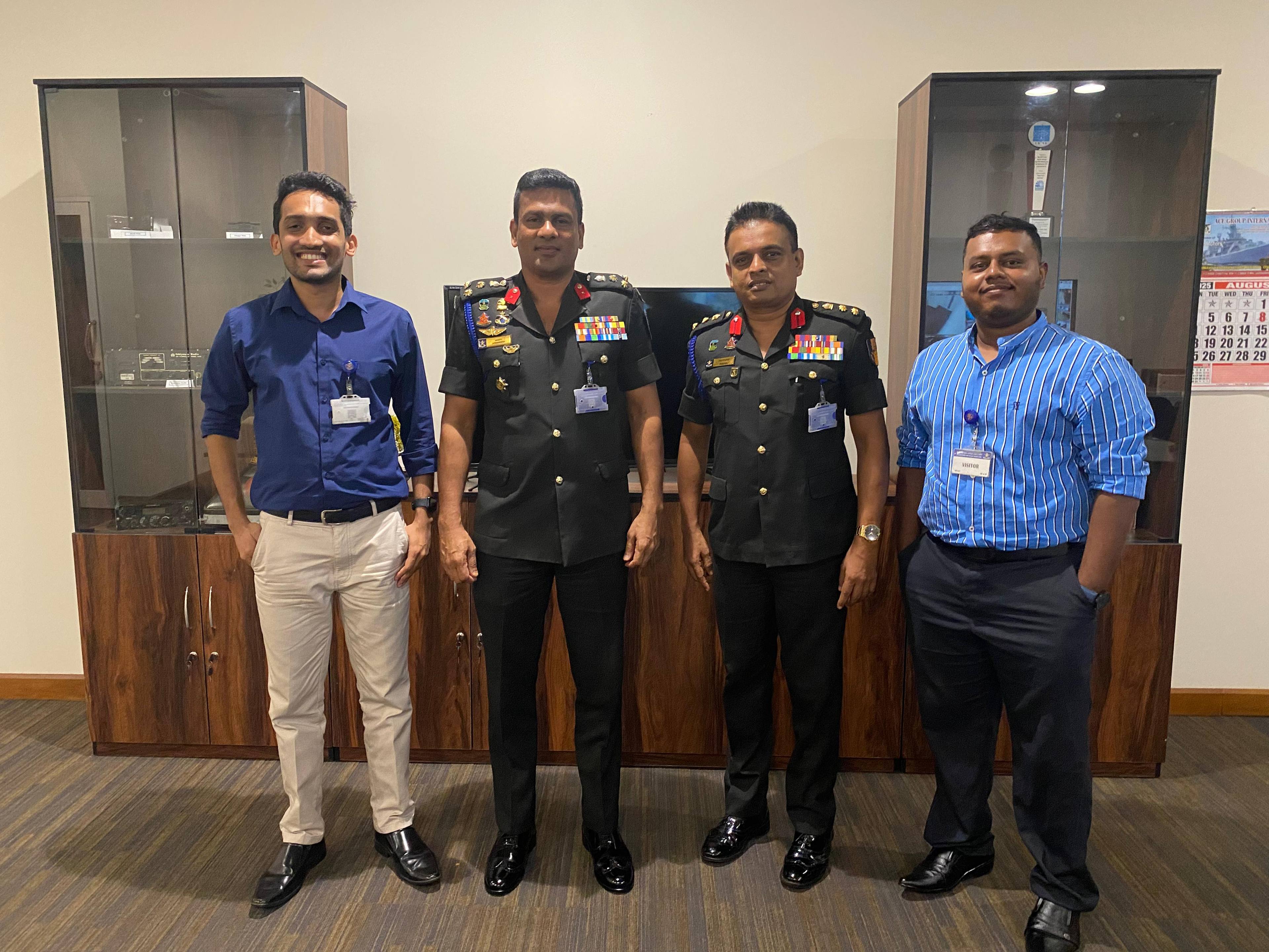 Aweesha Wijesundara with the brigadier and general who initiated the AI session, at the Defence Headquarters Complex