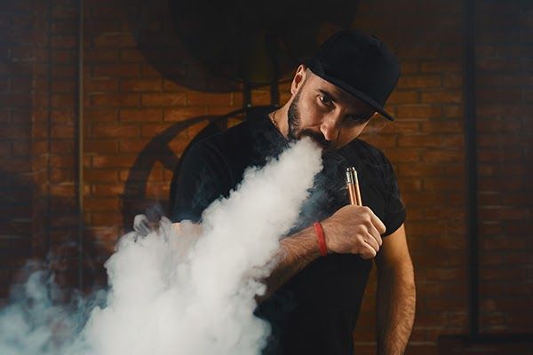 man vaping electronic cigarette