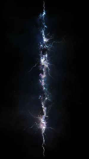 Dazzling vertical cosmic lightning bolt with blue and purple electric arcs against a dark star-filled background.