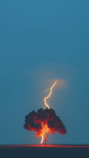 Surreal 4K wallpaper of a tree glowing red as a lightning bolt strikes under a minimal blue sky.