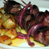 Beef Fillet Skewers & Onions accompanied with sautéed potatoes
