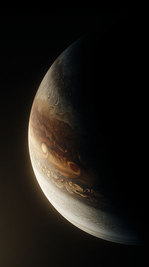 High-resolution close-up of Jupiter’s swirling cloud bands and storms, illuminated in golden hues against the dark void of space.