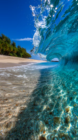 Photorealistic barrel wave curling over tropical shore with crystal clear turquoise water, ultra HD 8K mobile background.