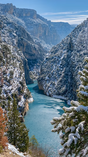 Winter landscape canyon river centered on a turquoise and snow white background in a crisp natural aesthetic