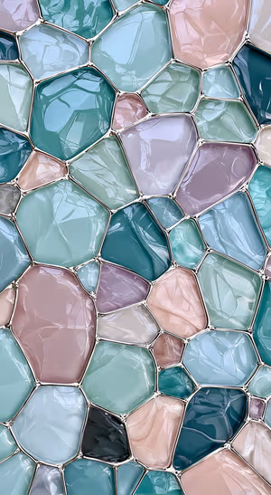 Polished geometric glass mosaic in pastel teal and lavender tones with a translucent abstract aesthetic.