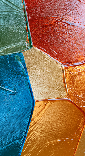 Abstract geometric texture in a colorful glossy jewel tone aesthetic.