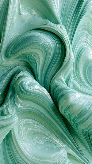 Glossy fluid marble swirl centered on a seafoam green background in a smooth abstract aesthetic, ultra hd 8K image.