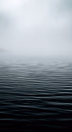Minimalist ocean ripples beneath a soft gray fog in a minimalist aesthetic.