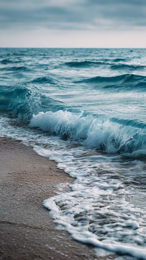 Minimalist ocean waves close up on a teal shoreline, ultra HD 8K background for iPhone Lock Screen.