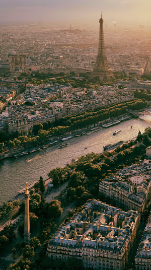 Cinematic aerial view of Paris with the Eiffel Tower and Seine River in warm golden tones, ultra hd 8K background.