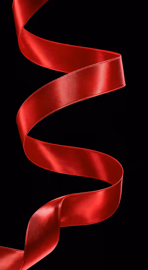 Minimalist red satin ribbon flowing over a black background in a dramatic aesthetic.
