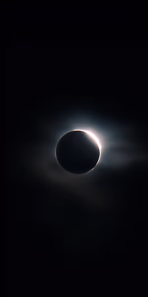 Photorealistic solar eclipse with diamond ring and glowing corona centered on a deep black background Ultra HD 8K image.