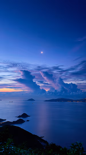 Minimalist twilight seascape with deep indigo and purple tones, cloud towers and moonlit reflection ultra hd iPhone background
