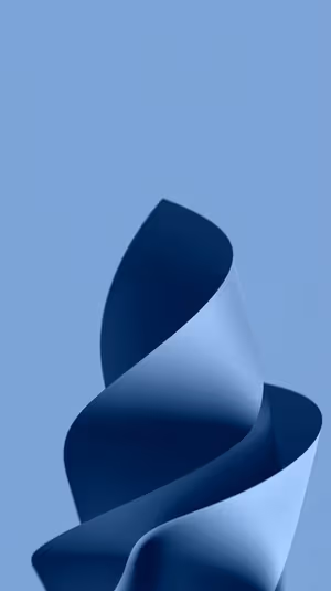 Minimalist paper spiral centered on a soft sky blue background with textured curl and studio light