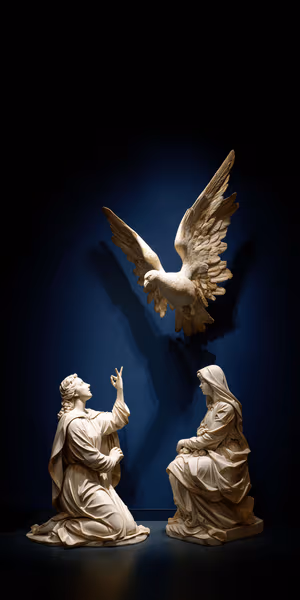Classical marble Annunciation sculpture with two figures and a dove against a deep navy background ultra HD 8K.