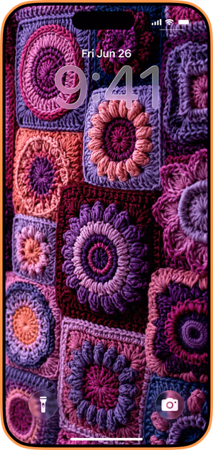 Wallpaper preview on iPhone 17 Pro Max running iOS 26 - Granny Square Bloom