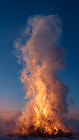 Cinematic towering bonfire on a deep blue dusk background with glowing orange flames, ultra HD wallpaper