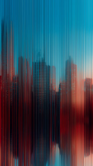 Futuristic city skyline seen through vertical metallic streaks in blue and red gradient abstract style.