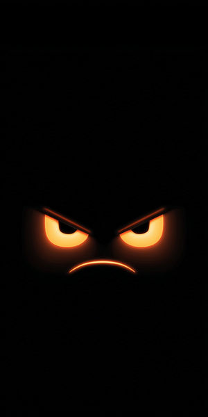 Close-up of glowing neon orange angry eyes against a pitch-black background, creating an intense minimalist vibe.