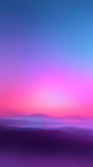 Pastel pink and blue sunset gradient over layered misty mountains, creating a serene minimalist horizon for wallpapers.