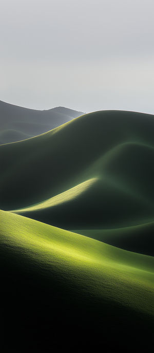 Soft light illuminates rolling green hills under a pale sky, creating a minimalist serene landscape view.