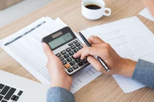 finance accounting paper desk using