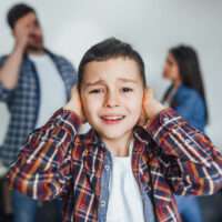 Small boy listening quarrel between parents!