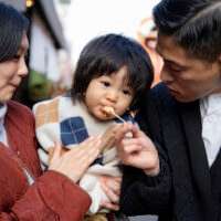 young-family-spending-time-with-their-toddler