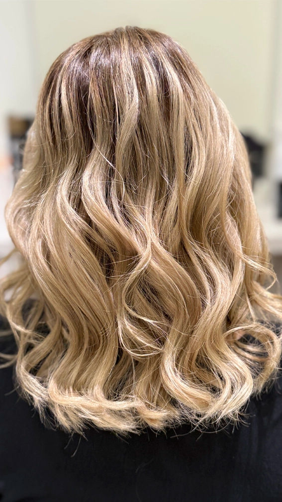 Woman with blonde wavy hair