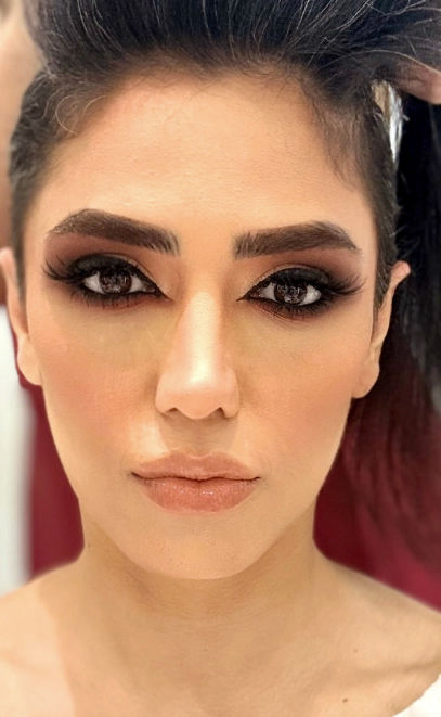 Woman with bold, glamorous makeup