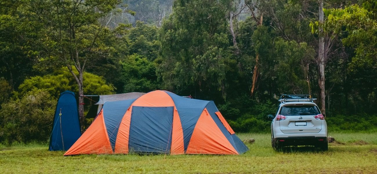 Pop up tent next to car